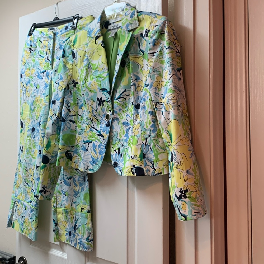 Floral print-Greens, yellows and blues on white.Eyehook needs stitching one side